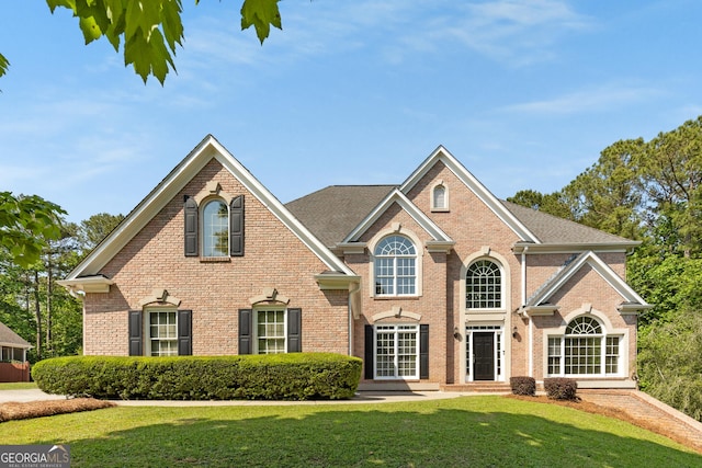 679 Gold Valley Pass, Canton, GA 30114 - view of front of home with a front lawn and brick siding