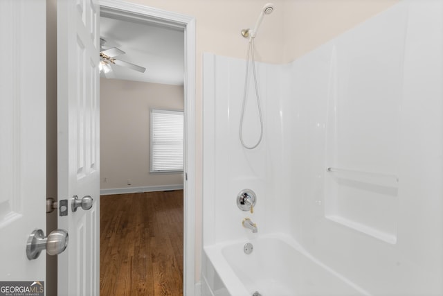 679 Gold Valley Pass, Canton, GA 30114 - bathroom with bathing tub / shower combination, baseboards, and wood finished floors