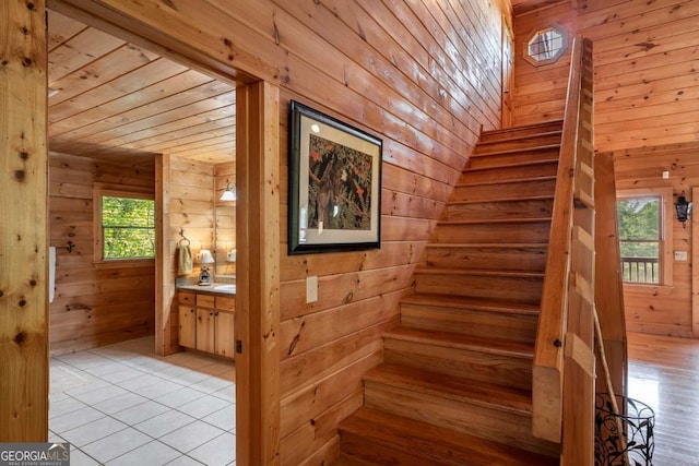 433 Spruce Cir, Mineral Bluff, GA 30559 - staircase featuring wooden ceiling, tile patterned floors, and wood walls