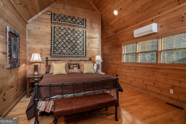 433 Spruce Cir, Mineral Bluff, GA 30559 - bedroom with visible vents, wood walls, lofted ceiling, wood ceiling, and a wall unit AC