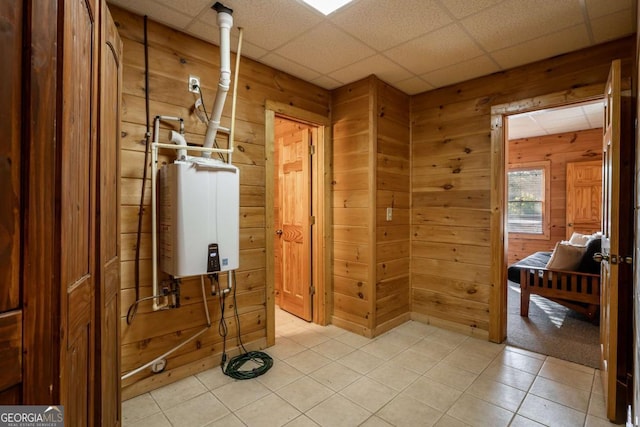 433 Spruce Cir, Mineral Bluff, GA 30559 - interior space featuring wood walls, a paneled ceiling, water heater, and tile patterned floors
