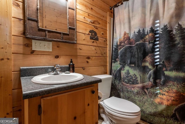 433 Spruce Cir, Mineral Bluff, GA 30559 - full bathroom with wooden walls, toilet, curtained shower, and vanity