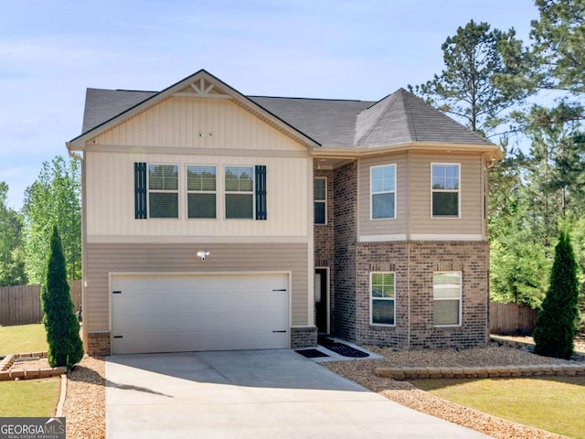 view of front of house featuring an attached garage, fence, driveway, and brick siding