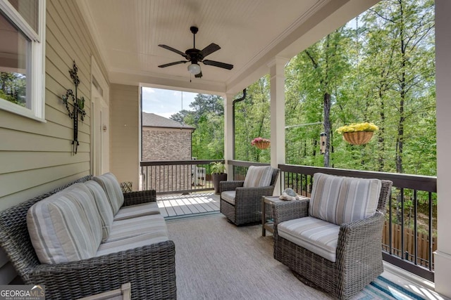 wooden deck featuring a ceiling fan