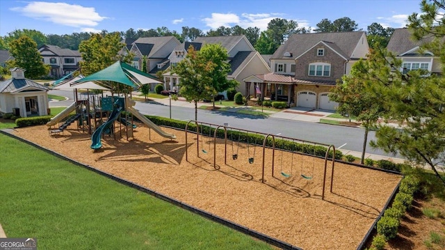 community jungle gym with a residential view