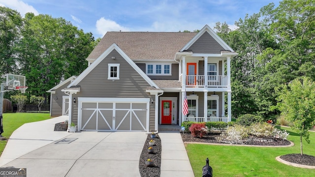 6413 Maple Park Ln, Hoschton, GA 30548 - view of front of home with a front lawn, a garage, concrete driveway, a balcony, and covered porch