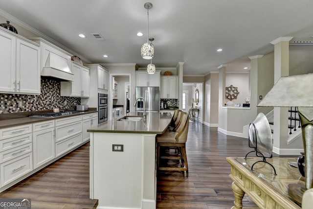 6413 Maple Park Ln, Hoschton, GA 30548 - kitchen with ornamental molding, appliances with stainless steel finishes, and dark countertops