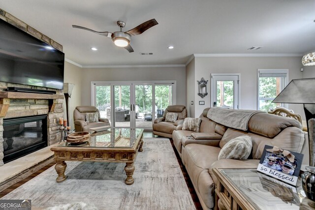 6413 Maple Park Ln, Hoschton, GA 30548 - living area featuring a wealth of natural light, ceiling fan, wood finished floors, and visible vents