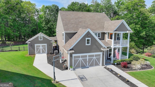 6413 Maple Park Ln, Hoschton, GA 30548 - view of side of property featuring covered porch, a lawn, a balcony, and roof with shingles