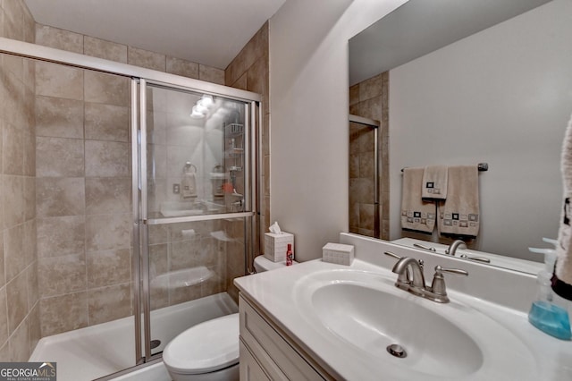 6413 Maple Park Ln, Hoschton, GA 30548 - full bath with vanity, a stall shower, and toilet