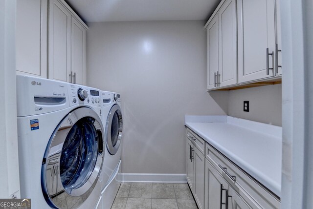 6413 Maple Park Ln, Hoschton, GA 30548 - laundry room with baseboards, cabinet space, light tile patterned floors, and washer and dryer