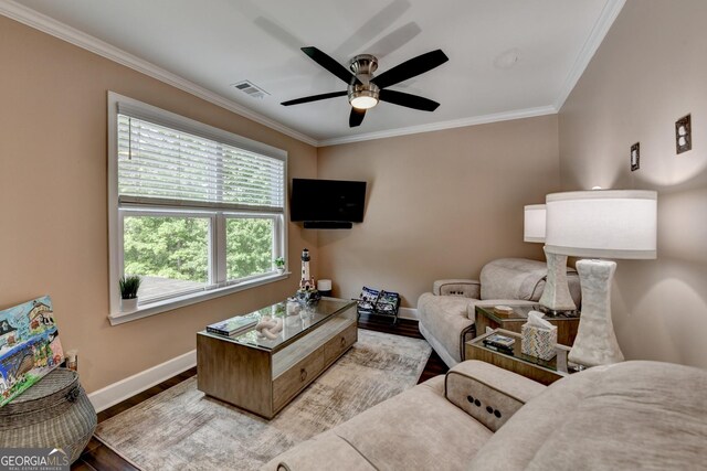 6413 Maple Park Ln, Hoschton, GA 30548 - living room with baseboards, ornamental molding, wood finished floors, and visible vents