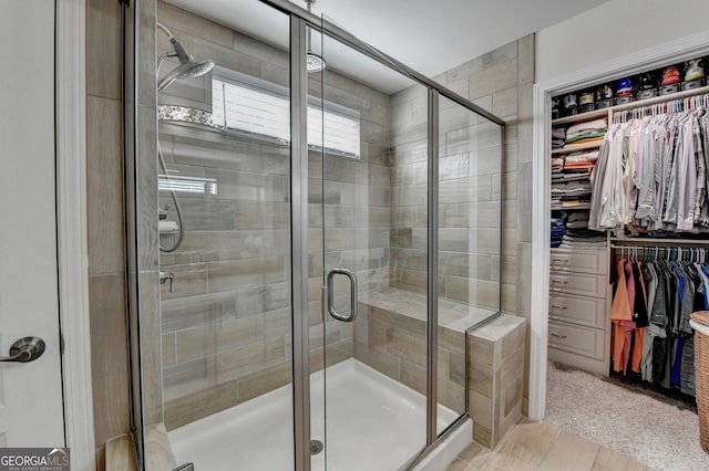 6413 Maple Park Ln, Hoschton, GA 30548 - bathroom featuring a shower stall and a walk in closet