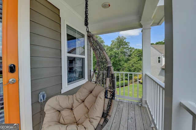 6413 Maple Park Ln, Hoschton, GA 30548 - wooden deck featuring covered porch