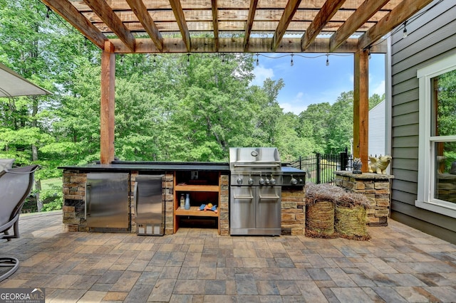 6413 Maple Park Ln, Hoschton, GA 30548 - view of patio / terrace with fence, exterior kitchen, a pergola, and area for grilling