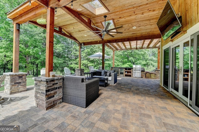 6413 Maple Park Ln, Hoschton, GA 30548 - view of patio with french doors, a ceiling fan, an outdoor living space, and exterior kitchen
