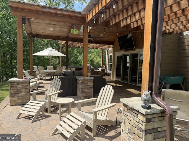 view of patio with a ceiling fan and outdoor dining area