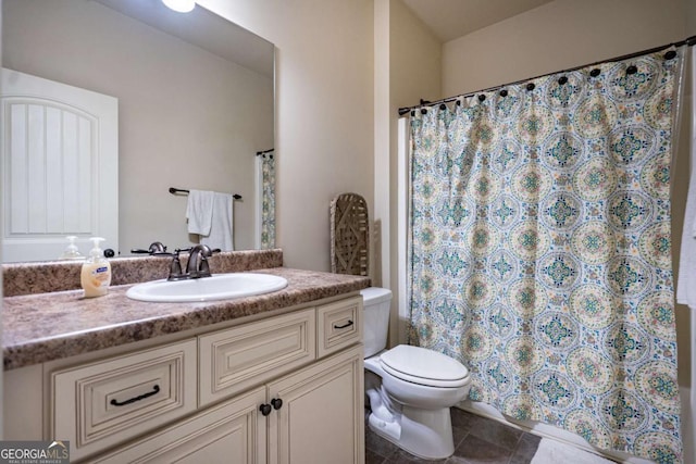 bathroom featuring vanity, tile patterned floors, toilet, and a shower with curtain