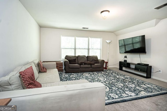 carpeted living room featuring visible vents and baseboards