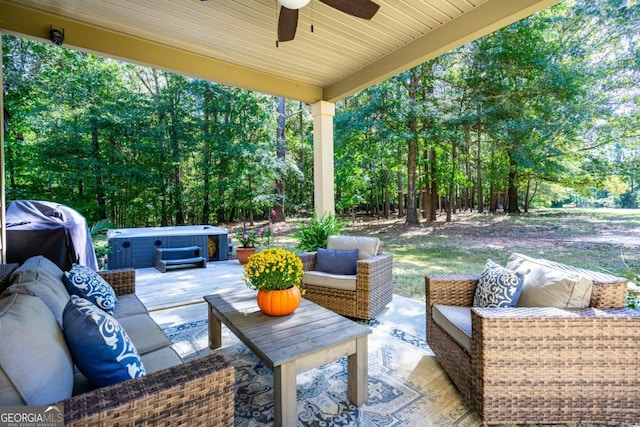 view of patio / terrace with ceiling fan, a hot tub, an outdoor hangout area, and a grill