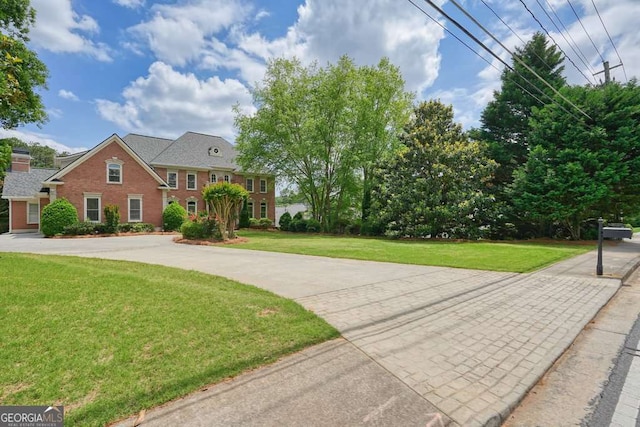 3689 Spring Hill Rd SE, Smyrna, GA 30080 - view of front of property with a front yard and brick siding