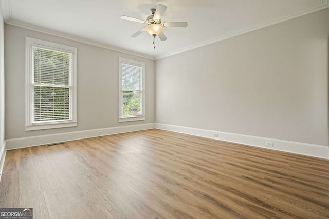 3689 Spring Hill Rd SE, Smyrna, GA 30080 - unfurnished room featuring crown molding, baseboards, ceiling fan, and wood finished floors