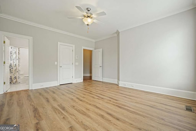 3689 Spring Hill Rd SE, Smyrna, GA 30080 - unfurnished bedroom featuring visible vents, light wood-type flooring, baseboards, ornamental molding, and ensuite bath
