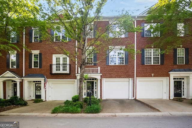 2108 Waters Edge Trl, Roswell, GA 30075 - townhome / multi-family property featuring driveway, an attached garage, and brick siding