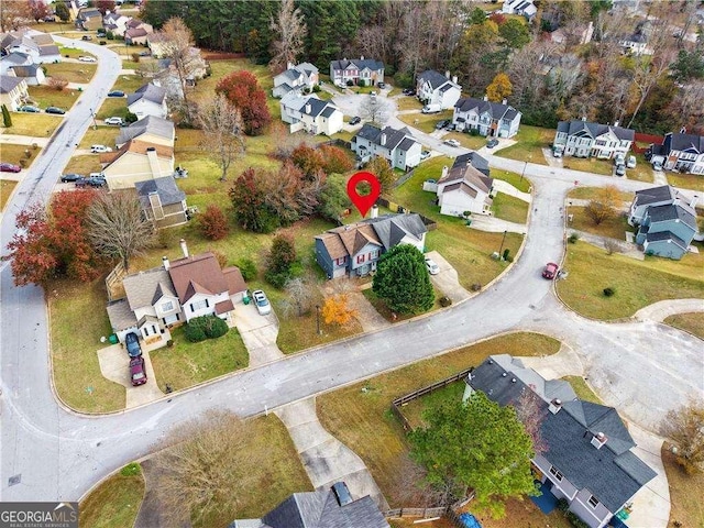 birds eye view of property with a residential view