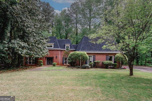 110 Vistacrest Way, Roswell, GA 30075 - view of front of house with brick siding, mansard roof, a shingled roof, and a front lawn