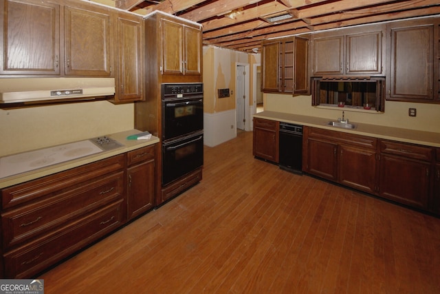 110 Vistacrest Way, Roswell, GA 30075 - kitchen featuring dobule oven black, range hood, a sink, light countertops, and light wood-style floors