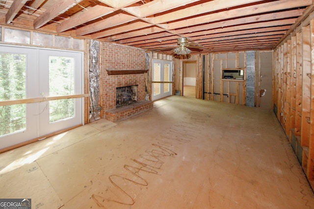 110 Vistacrest Way, Roswell, GA 30075 - unfurnished living room featuring a brick fireplace, ceiling fan, and french doors