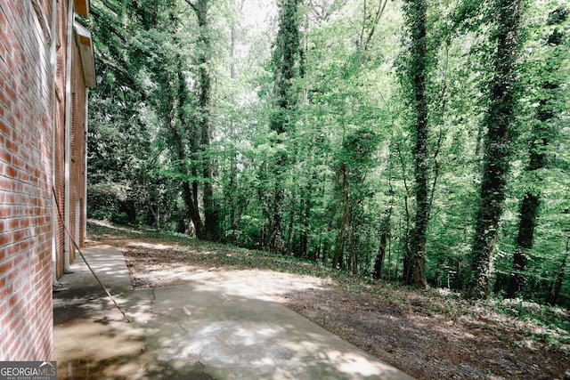 110 Vistacrest Way, Roswell, GA 30075 - view of yard featuring a patio and a wooded view