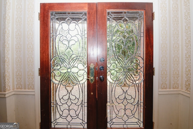 110 Vistacrest Way, Roswell, GA 30075 - details featuring a wainscoted wall, french doors, wallpapered walls, and a decorative wall