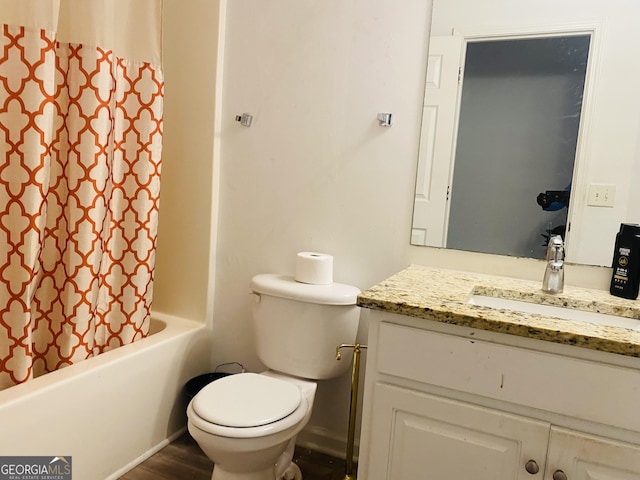 full bath featuring vanity, toilet, wood finished floors, and shower / tub combo