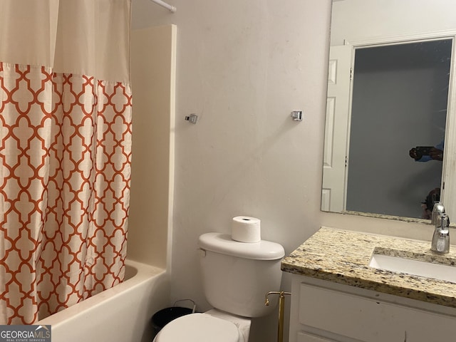 full bath with vanity, shower / bath combo, and toilet