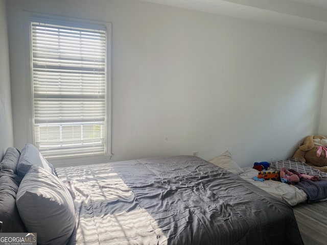 bedroom with wood finished floors