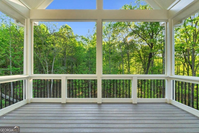 unfurnished sunroom featuring a wealth of natural light