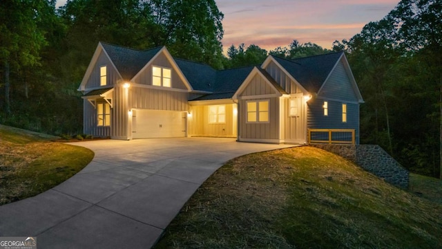 view of front of home with board and batten siding and driveway