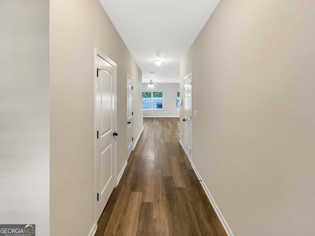 6001 Oak Bend Ct, Riverdale, GA 30296 - hall with dark wood-type flooring and baseboards