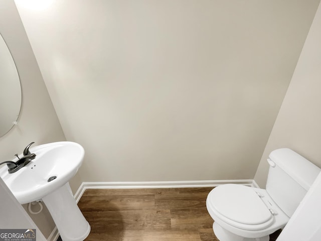 6001 Oak Bend Ct, Riverdale, GA 30296 - half bath with wood finished floors and toilet
