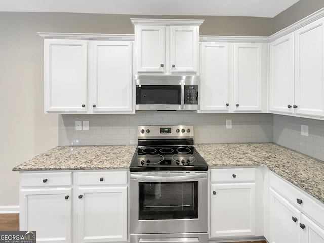 6001 Oak Bend Ct, Riverdale, GA 30296 - kitchen featuring stainless steel appliances, white cabinets, tasteful backsplash, and light stone counters