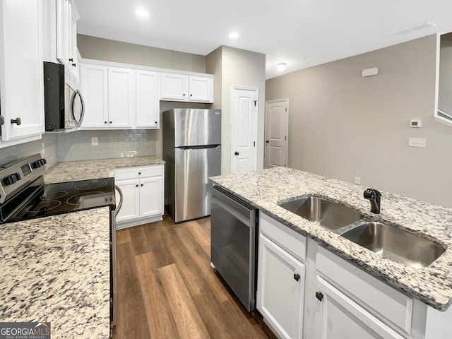 6001 Oak Bend Ct, Riverdale, GA 30296 - kitchen with stainless steel appliances, dark wood-type flooring, white cabinets, tasteful backsplash, and light stone counters