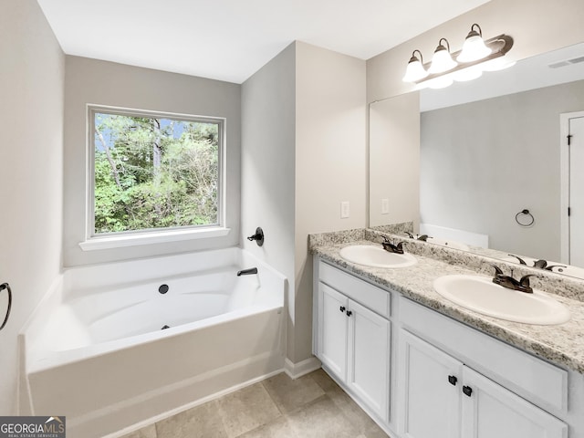 6001 Oak Bend Ct, Riverdale, GA 30296 - bathroom featuring double vanity and a bath