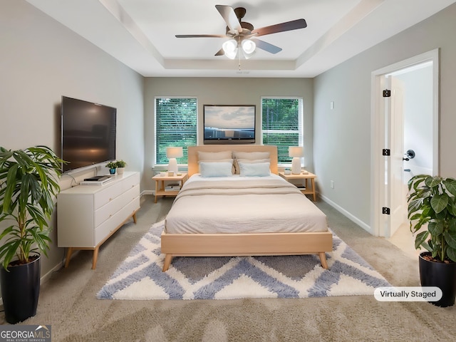 6001 Oak Bend Ct, Riverdale, GA 30296 - bedroom featuring carpet, a tray ceiling, and ceiling fan