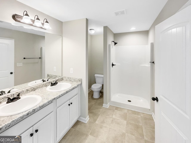 6001 Oak Bend Ct, Riverdale, GA 30296 - bathroom featuring double vanity and a shower