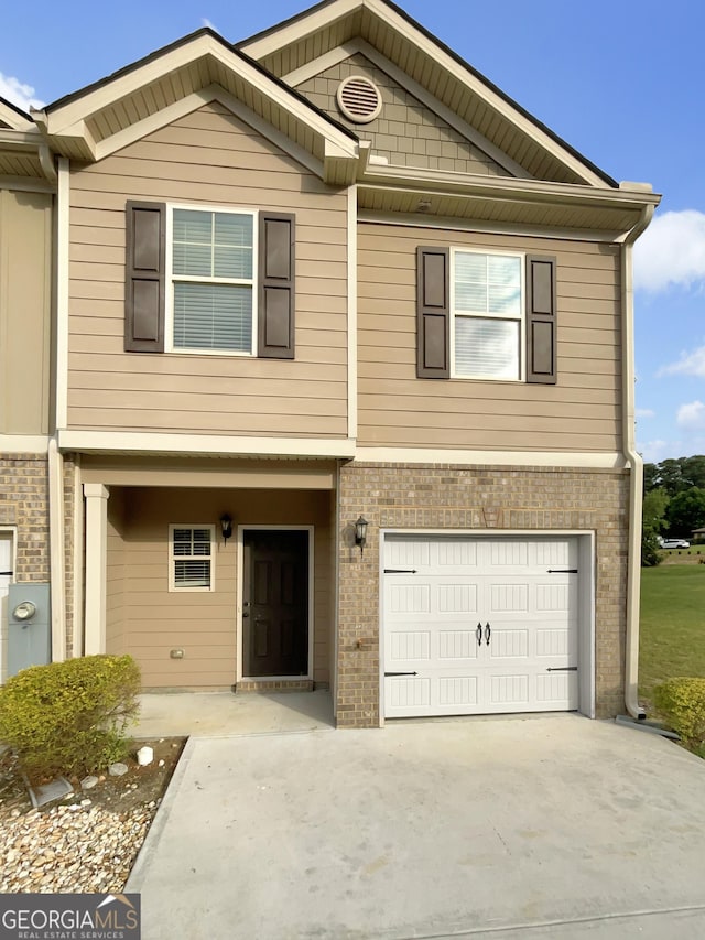 6001 Oak Bend Ct, Riverdale, GA 30296 - view of property featuring brick siding, an attached garage, and driveway