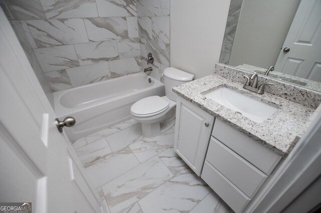 bathroom with toilet, tub / shower combination, marble finish floor, and vanity