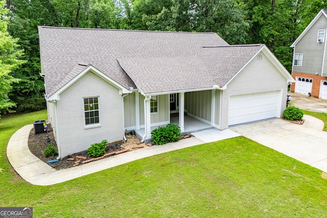 ranch-style house featuring roof with shingles, a garage, a porch, and brick siding