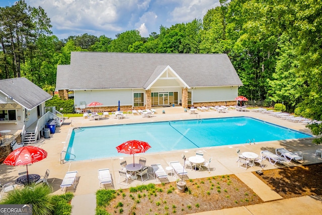 community pool with a patio area